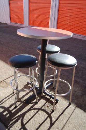 2 bar tables with 3 stools each
