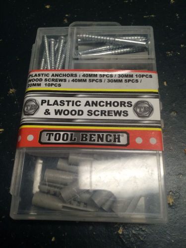 Brand new plastic anchors &amp; wood screws by tool bench