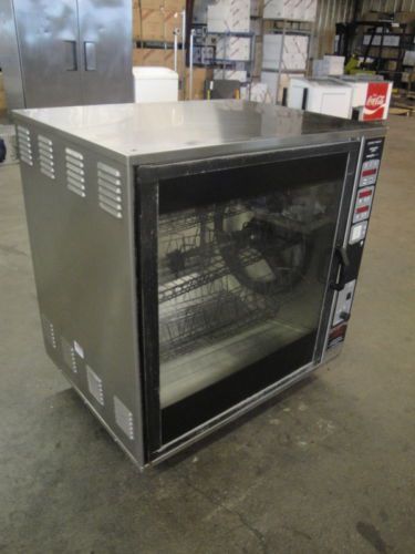 HENNY PENNY SINGLE STACK ELECTRIC ROTISSERIE OVEN ON CASTERS.