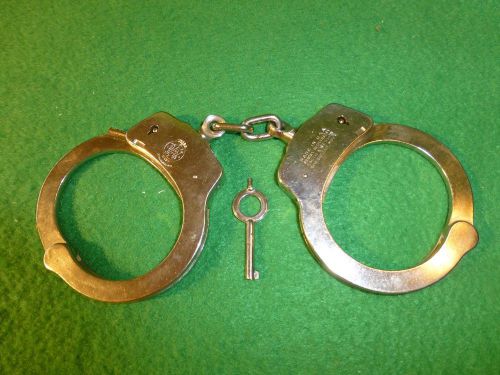 SMITH AND WESSON HAND CUFFS AND ONE KEY
