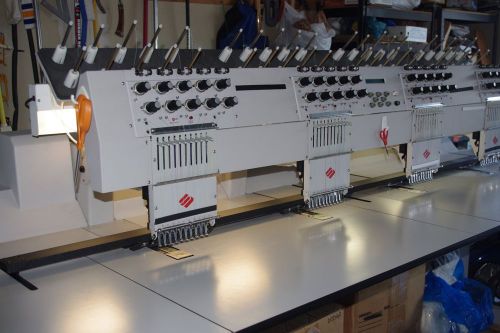 Melco commercial embroidery machine 4 head machine good condition includes hoops for sale