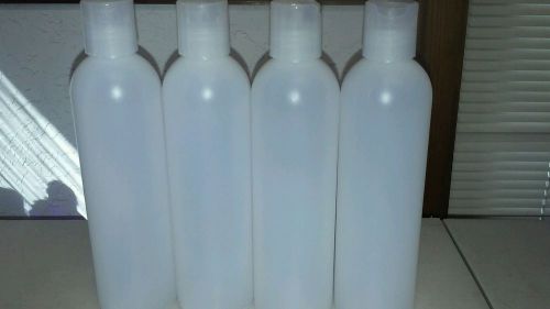 Lot (4)8 Oz Cosmo round natural Plastic bottles with disk top