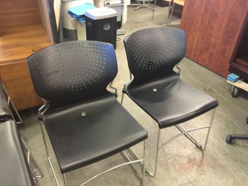 Plastic stack chair in black color w/ chrome sled base for sale