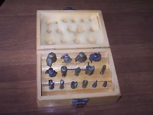 Really nice wooden box of router bits total of 15 different size bits