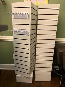 3 white slatwall tower with hooks for $100