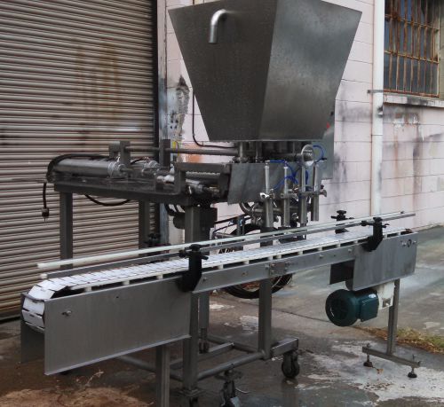 Four head fully automatic piston filler w/ auto indexing conveyor for sale
