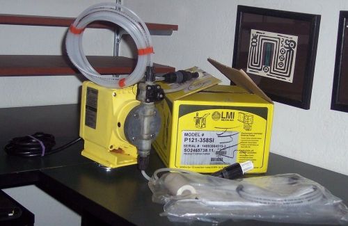 Lmi chemical metering pump mo.no. p121-358 si complete w. same series box. for sale