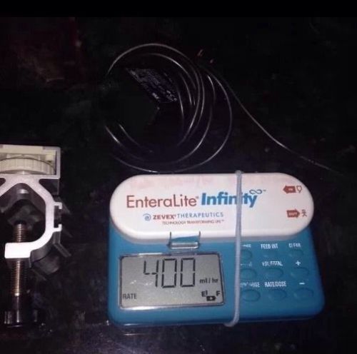Zevex enteralite infinity feeding pump, pole clamp and charger for sale