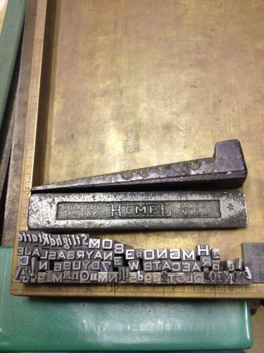 Vintage letterpress quoin lock and misc lead type