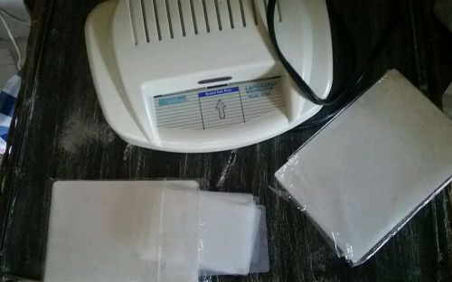 Mini- Laminating Machine with laminating sleeves and instructions.