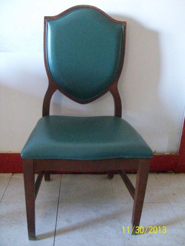 30 Green vinyl upholstered dining chair with cushioned back and seat