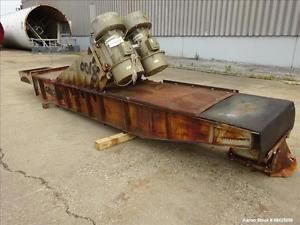 Used- Viratory Conveyor, Carbon Steel. Twin &#034;U&#034; shaped tough approximately 184&#034;
