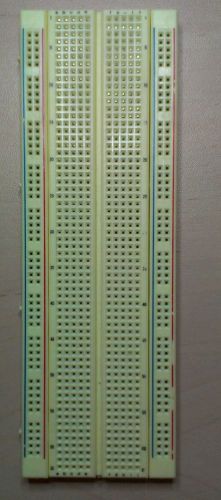 Solderless breadboard, two power buses, unused double sided tape backing