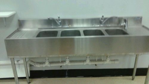 6 foot long 4 compartment stainless steel sink.  2 faucets with water softener.