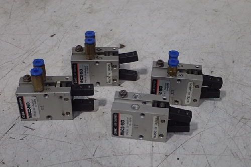 Four (4) smc mhc2-16d pneumatic grippers/ used/ lot of 4 for sale