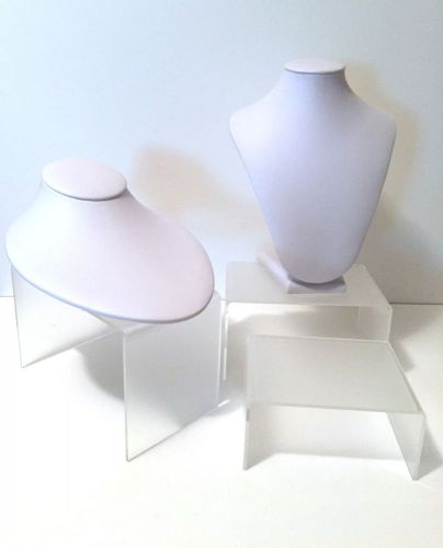 white jewelry busts with stands
