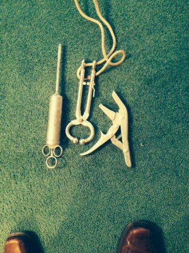 Cattle supplies- Metal oral dose syringe, nose lead, ear tag device. All work