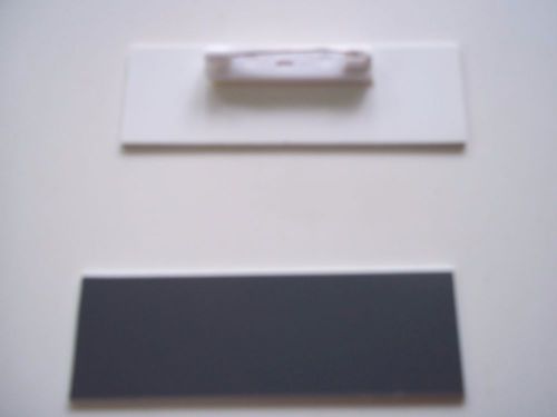 20 dark gray, with a white core, blank name badges tags 1x3&#034; with pins.