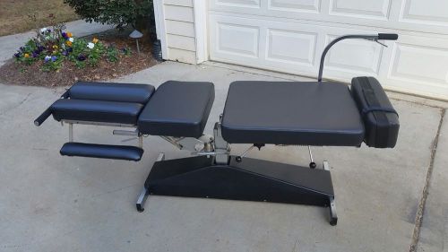 Used leander lite stationary flexion chiropractic table for sale