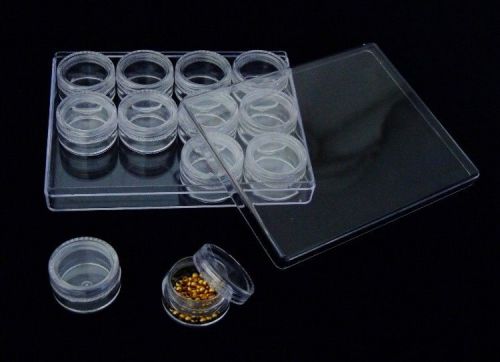 Clear plastic storage box with 12 clear jars with screw on lids for sale