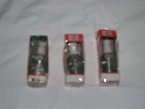 THREE VINTAGE NOS CHAMPION SPARKPLUGS.