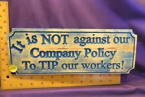 4308.  &#034;It is NOT against our company policy to tip our workers&#034; sign.