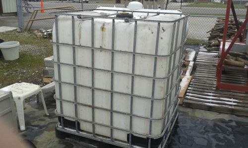 TOTE 300 GALLON PLASTIC CONTAINER WITH METAL FRAME FOR LIQUID STORAGE