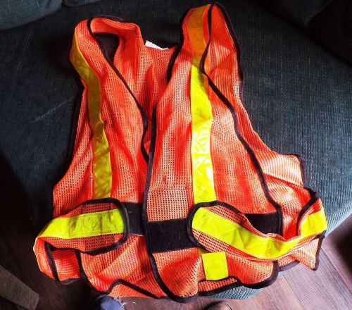 Used reflective yellow and orange safety vest.