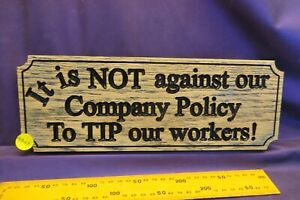 4307.  &#034;It is NOT against our company policy to tip our workers&#034; sign.