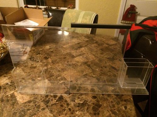 Two plastic display stand clear