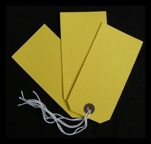 40 yellow strung tags 120 x 60 mm luggage price stock swingtags labels for sale