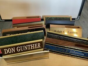 Nice lot of 11 nameplate holders some wooden some aluminum