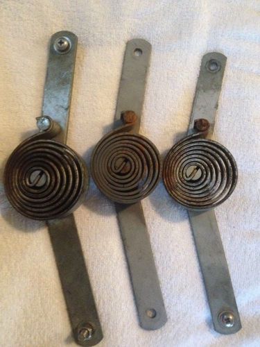 Lot of three fire truck compartment door springs for sale