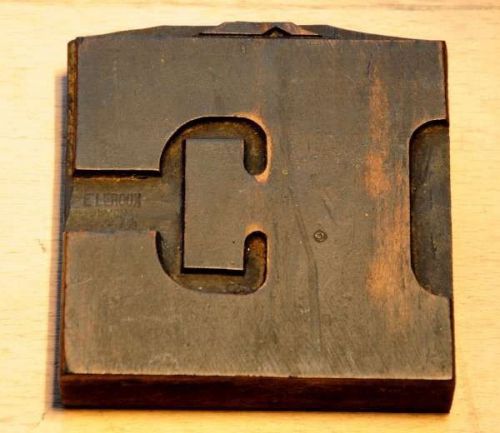 bold fat letter: E  old wooden letterpress printing block wood type antique
