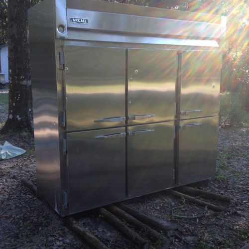 Used mcall stainless steel reach in refrigerator or freezer - 6 half-doors 220 v for sale