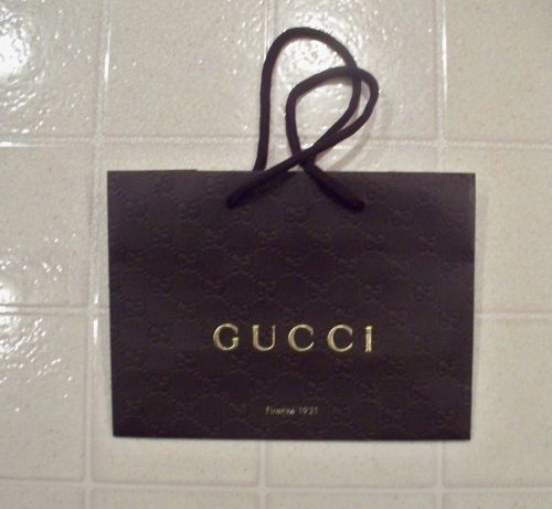 Embossed paper gift, shopping bag from Gucci with tissue paper