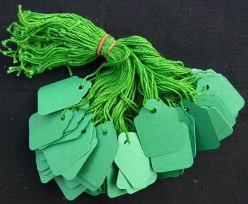 100 green strung price tags 32 x 22 mm traditional tie on swing tags free post for sale