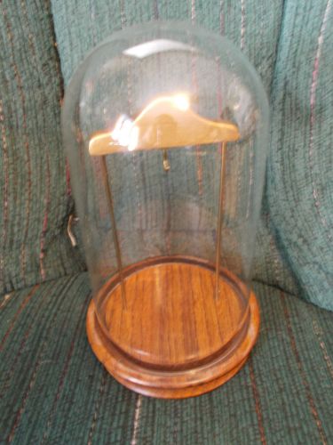 Approximately 7.5&#034; tall domed glass pocket watch display case w/wood base