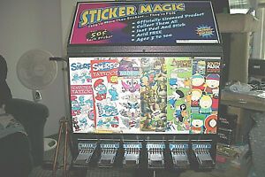 STICKER VENDING MACHINE   6 Slot  w/steel base  (Included are many stickers)