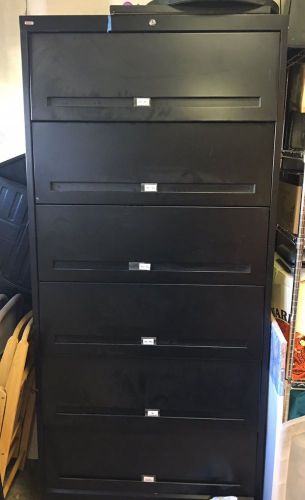black metal filing cabinet- 6 shelves, letter size, rolling cabinet doors
