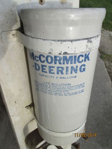Blue and white stoneware mccormick-deering lye solution dispenser crock mounted for sale