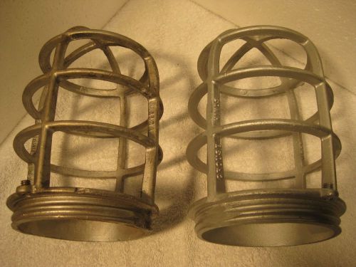 Two Crouse-Hinds metal explosion proof fixture covers