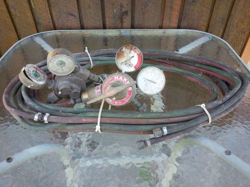 Old set of welding gauges regulator dual with hose for sale
