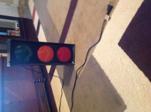 2 small and 1 large traffic cones with a black small traffic light for sale