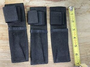 three black nylon flashlight/ baton sheath