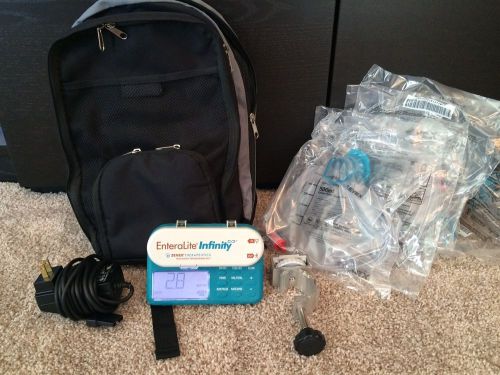 Zevex EnteraLite Infinity Feeding Pump w/ Extras -Backpack, Charger, Clamp, Bags