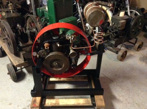 Antique hit miss magneto engine motor wheel