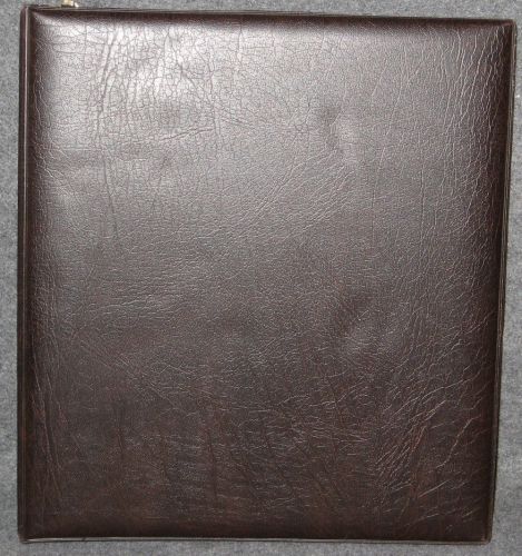 Brown Binder with 8 Double Sided Pages for Storage.