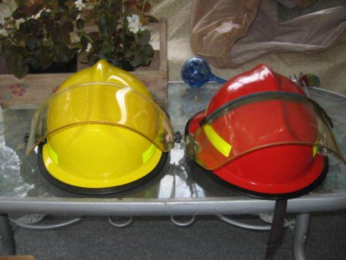 For sale are 2 fire helmets...1 is a yellow cairns  and 1 a red morning pride for sale