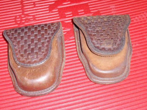 2 VINTAGE HAND TOOLED LEATHER HAND CUFF HOLDERS BY A.E. NELSON